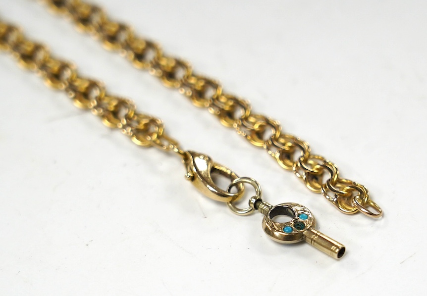 A yellow metal chain, the clasp arm stamped '750, one link stamped 9kt, hung with a small enamel set watch key, 42cm, gross weight 21.5 grams. Condition - fair